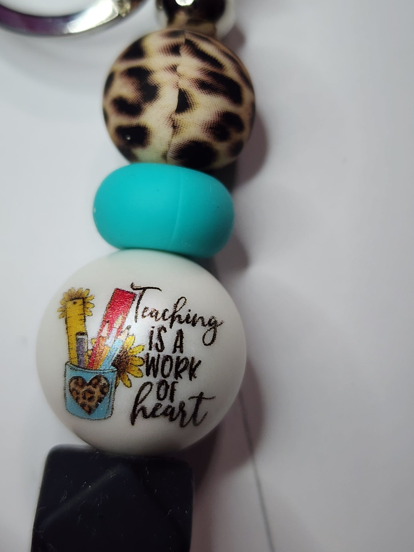Teaching is a work of heart (cheetah, turquoise, black) keychain