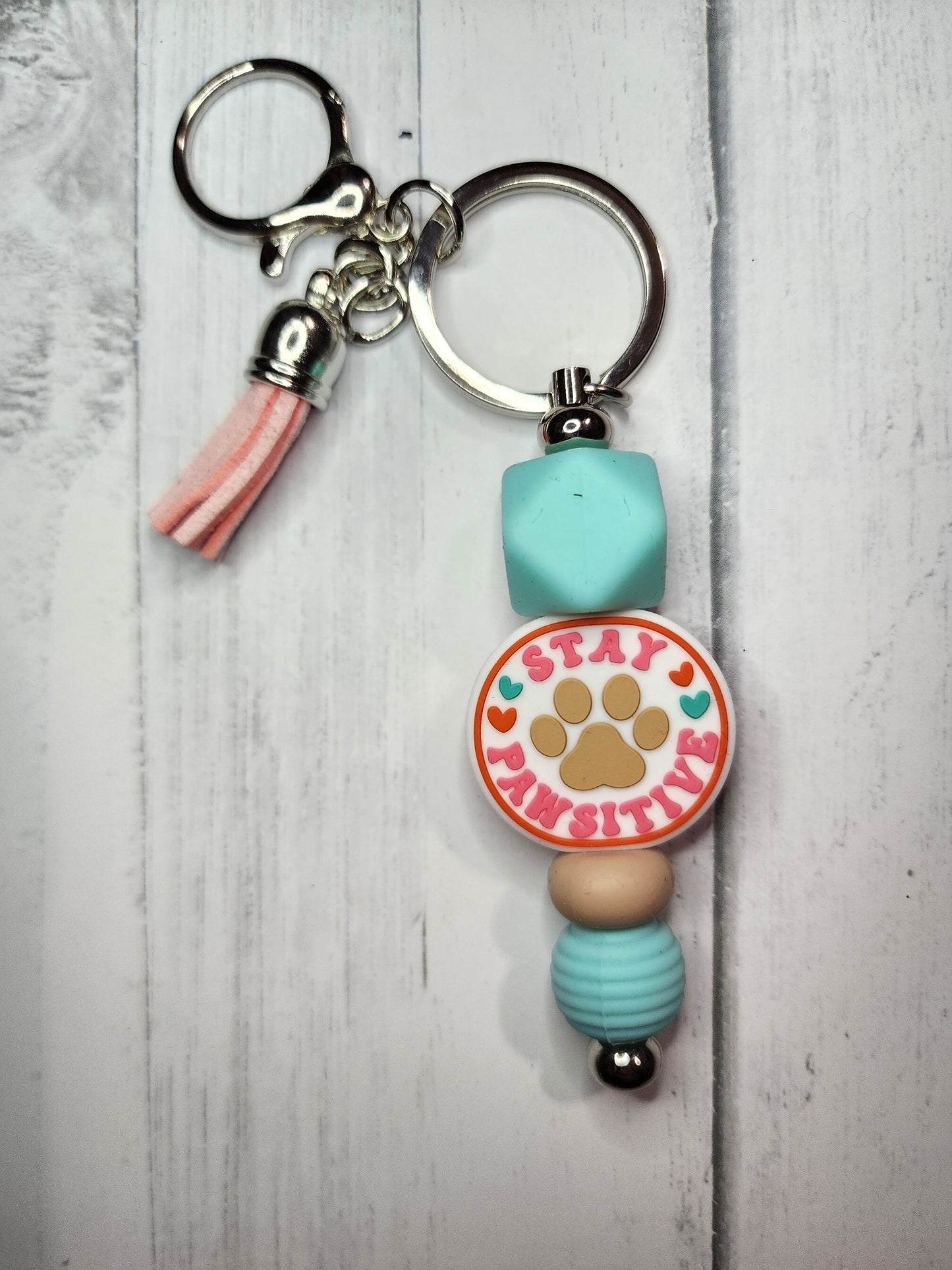 Stay pawsitive (turquoise hexagon) keychain