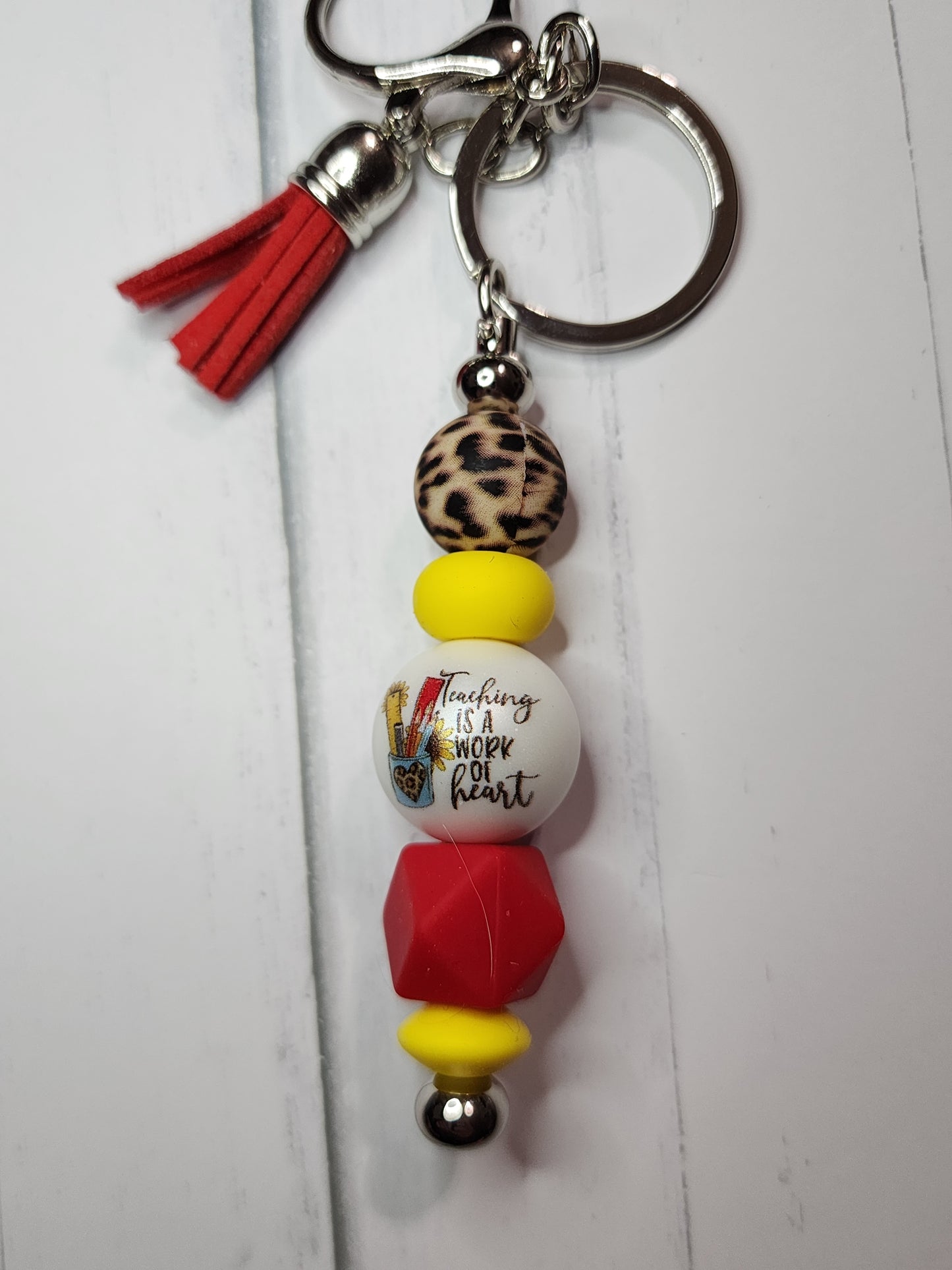 Teaching is a work of heart (cheetah, yellow, red) keychain