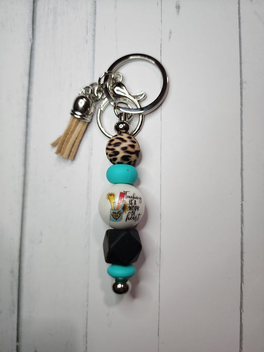 Teaching is a work of heart (cheetah, turquoise, black) keychain