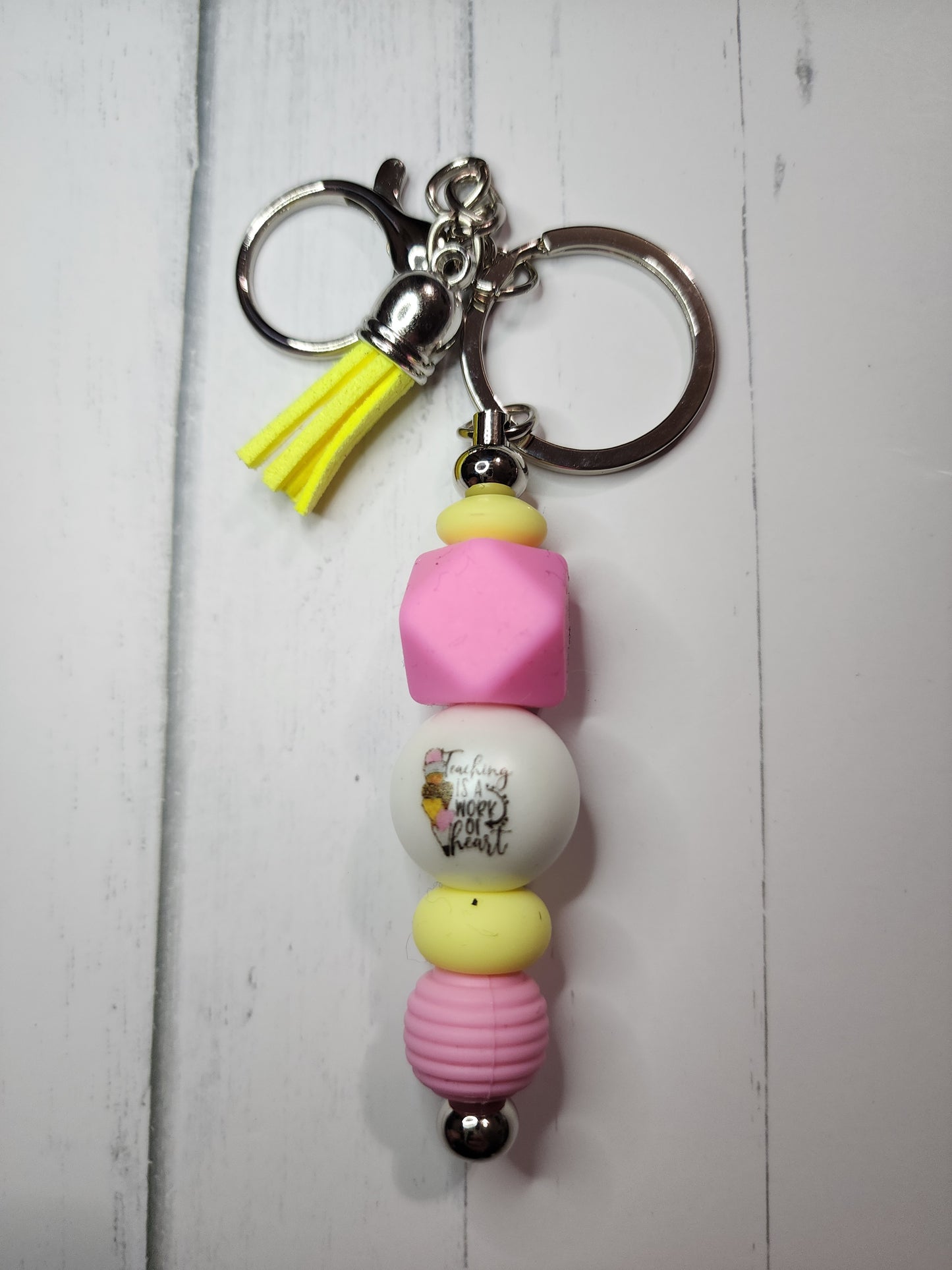 Teaching is a work of heart (pink, yellow) keychain