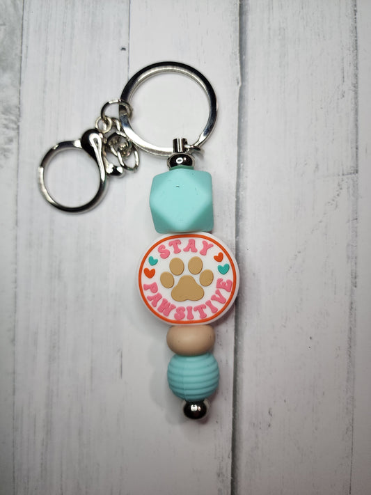 Stay pawsitive (turquoise hexagon) keychain