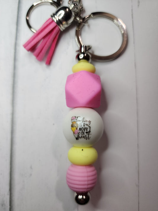 Teaching is a work of heart (pink, yellow) keychain